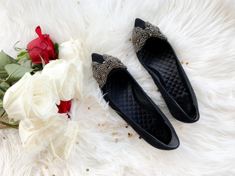 black and white polka dot slip on shoes on white textile