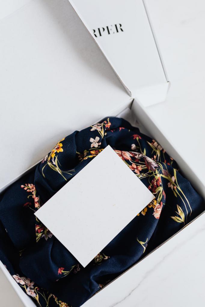 Luxury silk dress with empty postcard in package