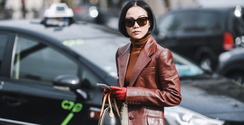 Asian woman wearing a leather blazer jacket in France