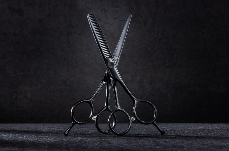 Professional Barber Hair Cutting Scissors And Thinning Shears. Hairdresser Salon Equipment Concept. On Black Background