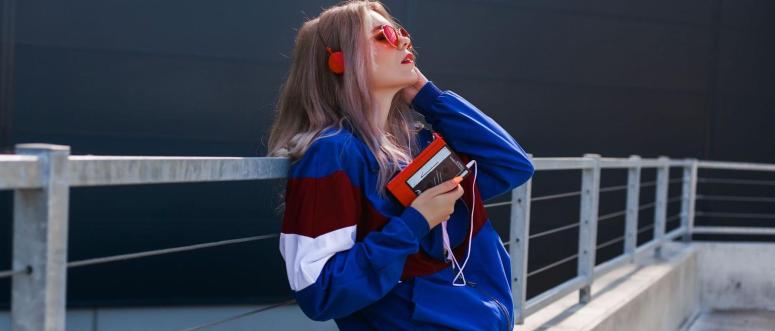 modern retro style 90s girl in a blue sports jacket modern retro style 90s girl in a blue sports jacket