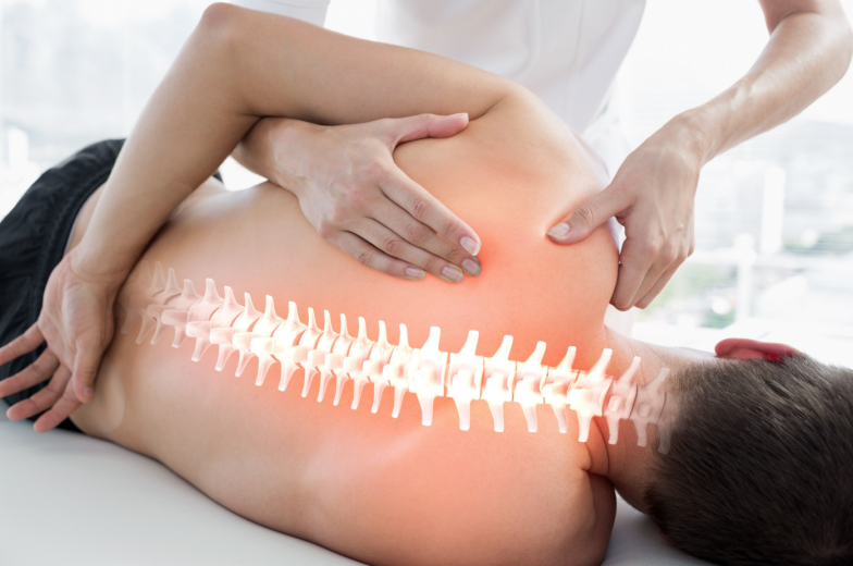 Digital composite of Highlighted bones of man at physiotherapy