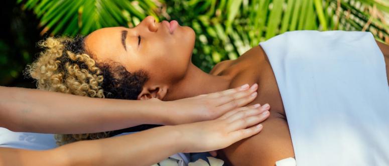 brazilian woman getting back and shoulders massaging in outdoor spa Ayurveda centre in India green tropical background brazilian woman getting back and shoulders massaging in outdoor spa Ayurveda centre in India green tropical background