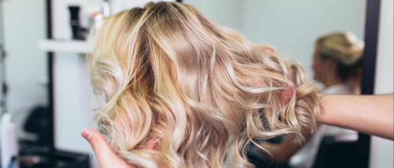 Beautiful hairstyle of young woman after dying hair and making highlights in hair salon Beautiful hairstyle of young woman after dying hair and making highlights in hair salon