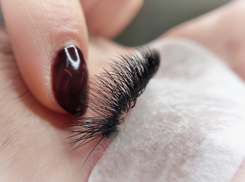 Lash extensions in beauty salon macro eye top view