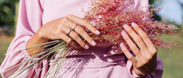 Close shot of romantic cute pink gel polished manicure nails Close shot of romantic cute pink gel polished manicure nails