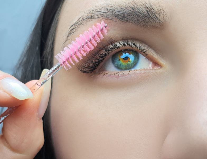 close up of women's eye with eyelash extensions in beauty salon macro eye top view.