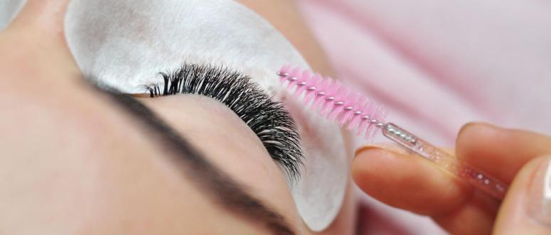 Lash extensions in beauty salon macro eye top view