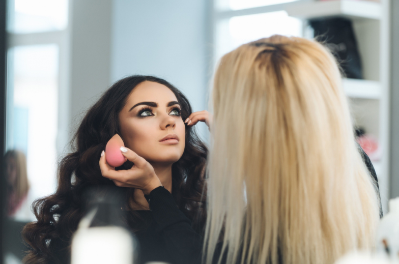 Makeup and hairstyle for a beautiful model, beauty saloon