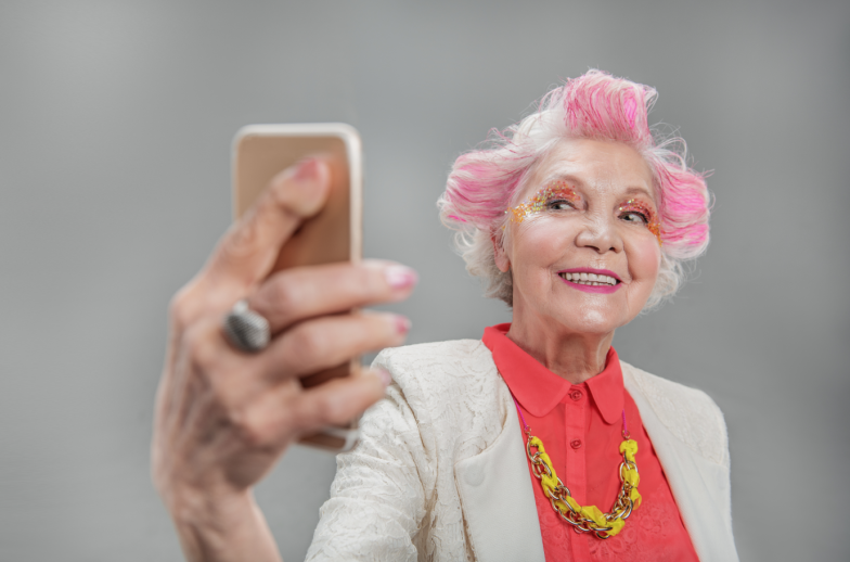 Senior beautiful woman with mobile