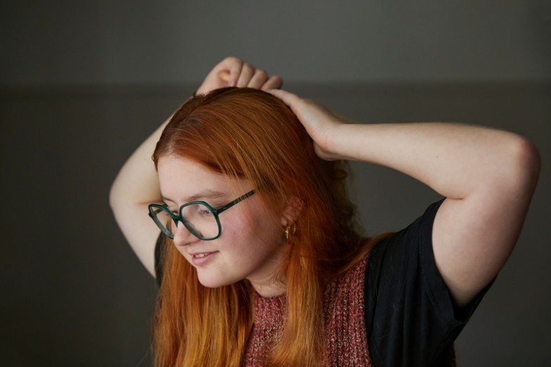 Red hair isn't just a color; it's a statement. It's bold, vibrant, and demands attention. Whether you're a natural redhead or have embraced the fiery hue through dye, styling red hair requires finesse and an understanding of its unique qualities. In this guide, we'll delve into the world of red hair styling, exploring tips, techniques, and trends to help you unleash the full potential of your crimson locks.  Understanding Red Hair Styling Red hair isn't just about color; it comes with its characteristics and challenges. Redheads often have thicker, coarser strands with a natural luster that sets them apart. However, maintaining this vibrant hue can be tricky and requires special care and attention. Understanding the nuances of red hair is the first step to mastering its styling techniques.  Tools and products for Hair Styling   Wide-toothed comb: Ideal for detangling without causing breakage or frizz; this is essential for maintaining the texture of red hair.  Color Safe Shampoo and Conditioner: Protects red hair from fading while maintaining its vibrancy, ensuring the fiery hue stays vibrant.  Heat Protect Spray: Shields hair from damage during heat styling, essential for maintaining red hair's natural shine and preventing color fade.  Everyday red hair styling tips Styling red hair for everyday wear requires a balance between maintaining its color and enhancing its natural appeal. Simple techniques such as blow-drying or using minimal heat can help preserve the vibrancy of red hair while embracing its inherent texture and shine.  Gentle wash routines: Opt for sulfate-free shampoos and conditioners to prevent color fading and maintain the vibrancy of red hair.  Air Dry: Allow your red locks to dry naturally to minimize heat damage and frizz and preserve red hair's natural texture and shine.  Light styling products: Use lightweight serums or creams to define curls or waves without weighing down red hair, enhancing its natural movement and volume.  Extraordinary Occasion Hairstyles for Red Hair When it's time to step out for special occasions, red hair offers a canvas for creating stunning looks that turn heads. From elegant updos to intricate braids, the versatility of red hair allows for endless styling possibilities that complement any occasion.  Classic bun: Sweep red hair into a sleek bun for a timeless, sophisticated look that highlights the richness of the color.  Braided crown: Weave red strands into an ethereal crown braid for a romantic, bohemian vibe that accentuates the natural warmth of red hair.  Vintage Waves: Embrace old Hollywood glamour with cascading waves that showcase red hair's rich color and texture for an elegant and sophisticated look.  Red hair maintenance and care Maintaining the vibrancy of red hair requires diligence and care. Regular trims, color-safe products, and UV protection are essential components of a red hair care routine that will keep your locks vibrant and healthy.  Regular trims: Schedule frequent trims to prevent split ends and maintain the shape and volume of red hair for a polished and healthy appearance.  UV Protection: Protect red hair from sun damage by using UV-protective hair products or wearing hats when outdoors to preserve its vibrant hue from fading.  Color-safe treatments: Invest in professional-grade color-protecting therapies to extend the life of your red hair's vibrant hue and ensure long-lasting color vibrancy.  Red hair styling trends and inspiration The world of red hair styling is constantly evolving, with new trends and inspiration emerging regularly. From bold colors to textured cuts, red hair offers endless opportunities for self-expression and creativity.  Bold color choices: Experiment with vibrant hues like copper, auburn, or cherry red to make a statement with your hair and embrace the fiery nature of red hair.  Textured cuts: Opt for layered or asymmetrical cuts to add depth and dimension to red hair, enhancing its natural volume and movement to create dynamic and eye-catching styles.  Vintage Inspiration: Draw inspiration from iconic ginger beauties of the past, from Marilyn Monroe to Jessica Rabbit, and incorporate their timeless glamour into your style, embracing the retro charm of red hair.  Red Hair with Confidence Styling red hair is as much about embracing its unique qualities as it enhances its beauty. With the proper techniques, tools, and products, you can unlock the full potential of your fiery locks and make a bold statement wherever you go. At MOBILESTYLES, we understand the importance of personalized beauty services that cater to your unique style and preferences. Explore our on-demand beauty services and let our experts help you unleash the power of red hair styling with confidence and flair.