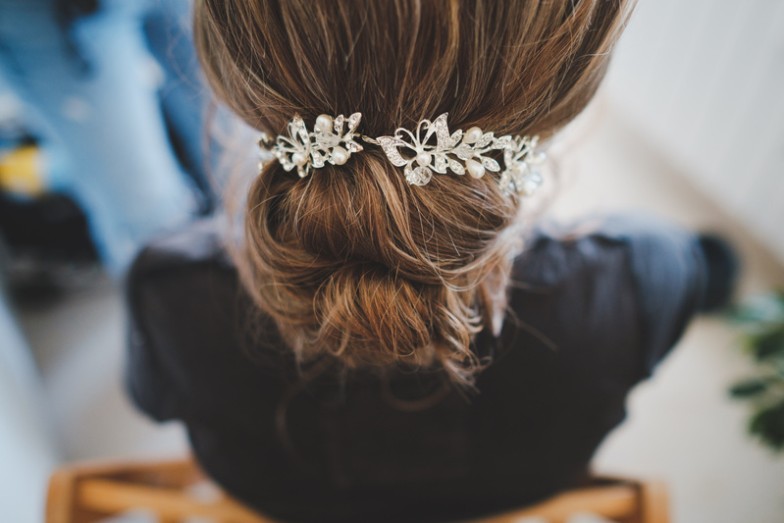 Your wedding day is a celebration of love, and your hair should be as special as the occasion. Discover the magic of beautiful wedding hairstyles that will make you feel like the belle of the ball. Whether you're looking for a romantic updo, a boho braid, classic Hollywood waves, or an elegant low bun, we've got you covered.  Your hair is your crowning glory, and on your wedding day, you deserve a style that reflects your personality and enhances your bridal beauty. Let's dive into these stunning wedding hairstyles to find the perfect one for your dream day.  1. Romantic Updo Timeless and versatile, the romantic updo is a classic choice that fits a variety of wedding themes. It effortlessly combines elegance with a touch of modern romance.  Prep Your Hair: Start by prepping your hair with the right products to add texture and hold.  Create loose curls: Use a curling iron to create loose, cascading curls.  Gather into a low bun: Gather the curls into a low bun, leaving a few strands loose for a soft, romantic touch.  Secure and Finish: Secure the updo with pins and finish with a mist of hairspray for hold.  Styling Tips  Finish the look with delicate hair accessories for a touch of sparkle.  Consider face-framing tendrils for a softer, more whimsical look.  Your wedding day is all about timeless moments, and the romantic updo ensures you'll look back on your photos with delight.  2. Boho Braided Crown Embrace a carefree and bohemian vibe with the Boho Braided Crown. This ethereal style is perfect for outdoor or rustic weddings.  Center part: Part your hair down the middle to create two even sections.  Loose Braids: Create two loose braids on each side, making sure they are not too tight.  Create the crown: Cross the braids over your head and secure them in a crown shape with pins.  Loose strands: Allow a few loose strands to frame your face for an effortless finish.  Styling Tips  Incorporate flowers or greenery into the braids for a boho-chic touch.  Enhance the texture with a touch of sea salt spray for a relaxed, beachy feel.  The boho braid is not just a hairstyle; it's a statement that says, "I'm here to celebrate love in style.  3. Classic Hollywood Waves Step into the glamour of the silver screen with classic Hollywood waves. This sophisticated style is the epitome of timeless elegance, perfect for formal and black-tie weddings.  Voluminous waves: Use a large barrel curling iron to create voluminous waves that cascade gracefully.  Brush for softness: Brush through curls to create soft, flowing waves that evoke old Hollywood glamour.  Side part: Part the hair on the side for a classic Hollywood look.  Finishing Touch: Finish the look with a mist of hairspray to hold the waves in place.  Styling Tips  Opt for a deep side part to add an extra dose of drama to your bridal look.  Use a shiny serum for a shiny, polished finish.  Classic Hollywood waves aren't just a hairstyle; they're a nod to the timeless beauty of iconic movie stars.  4. Elegant low bun For a polished and sophisticated bridal look, the elegant low bun is a timeless choice that complements a variety of face shapes and bridal gown styles.  Gather into a low ponytail: Begin by gathering your hair into a low ponytail at the nape of your neck.  Twist into a bun: Twist the ponytail into a sleek bun and secure with pins.  Smooth flyaways: Use a small amount of styling cream to smooth any flyaways for a polished finish.  Set with hairspray: Finish the look with a mist of hairspray to ensure the bun stays in place throughout the party.  Styling Tips  Add elegance with a decorative hairpin or comb.  Keep the bun sleek for a modern and sophisticated aesthetic.  The elegant low bun is not just a hairstyle; it's a testament to the grace and sophistication that defines timeless beauty.  Bottom Line Your wedding day is a canvas, and your hair is the brushstroke that completes the masterpiece. Beautiful wedding hairstyles allow you to express your style, embrace romance, and celebrate love. From the romantic updo to the boho braid, and classic Hollywood waves to the elegant low bun, each style tells a unique story.  Choosing the perfect wedding hairstyle is a personal journey, and we hope this guide has inspired you to find the one that matches your bridal vision. Remember, your wedding day is about you, your love story, and the beginning of a beautiful adventure.  As you plan your wedding beauty journey, MobileStyles is here to connect you with talented beauty professionals who specialize in creating the perfect bridal look. Your dream wedding starts with a vision, and your vision comes to life with the right team of beauty professionals. Download the MobileStyles app today to discover the beauty professionals who will make your wedding day truly magical. Let's make every moment beautiful!