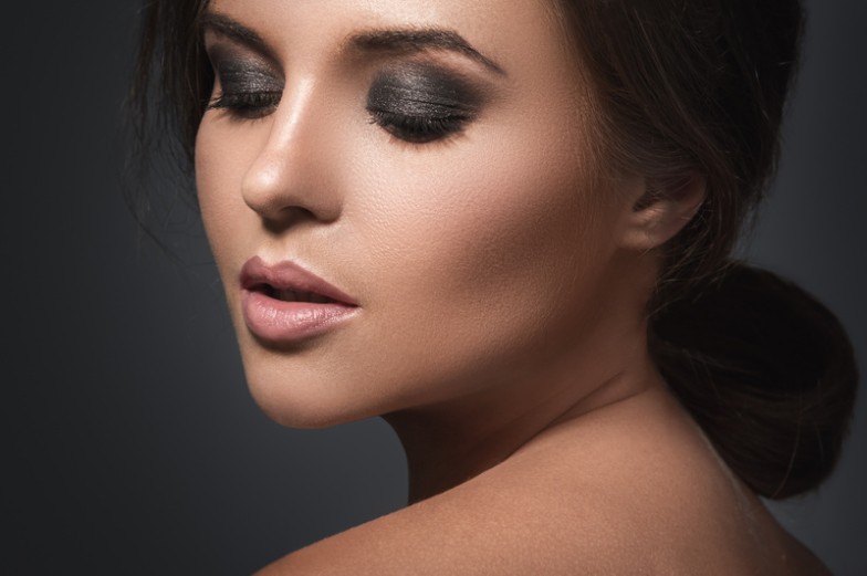 The smoky eye is a timeless makeup technique that adds depth, allure, and a touch of mystery to any look. Mastering it can elevate your makeup game, making it ideal for nights out, special occasions, or whenever you want to make a bold statement. This smokey eye tutorial will guide you through each step to help you quickly achieve this iconic style.  What is the Smokey Eye? More than just a makeup trend, the smoky eye is an expression of sophistication and drama that has stood the test of time. This technique involves blending dark shades of eyeshadow outward from the lash line, creating a gradient effect that makes the eyes the focal point. Before we dive into the smokey eye tutorial, let's explore some expert tips and essential tools to ensure your smoky eye is flawless.  Expert Tips and Tricks Before we get into the nitty-gritty of creating the perfect smoky eye, here are some professional tips to enhance your makeup styling process:  Start with a primer: Apply an eyeshadow primer to ensure your eyeshadow has a smooth canvas and stays in place all day.  Pick the correct shades: Pick a palette with a range of shades from light to dark to create a seamless gradient.  Blend, blend, blend: Blending is the key to a perfect smoky eye. Use a fluffy brush to soften harsh lines.  Highlight the inner corner: Brighten your eyes by adding a hint of shimmer to the inner corners.  Balance your makeup: Because the smoky eye is dramatic, keep the rest muted for balance.  Essential makeup tools and products The right tools and products are crucial to achieving a stunning smokey eye. Here's what you'll need:  Eyeshadow Primer: To enhance the pigmentation and longevity of your eyeshadow.  Neutral Eyeshadow Palette: This palette has shades from light to dark, including matte and shimmer finishes.  Blending Brush: A fluffy brush that blends eyeshadow seamlessly.  Pencil Eyeliner: To define the lash line and add depth to your look.  Mascara: To volumise and lengthen lashes to complete the smoky eye effect.  Smudge Brush: To smudge eyeliner for that signature smoky effect.  Highlighter: Add a subtle glow to the inner corners and brow bone.  Key Smokey Eye Techniques Mastering these techniques will help you create a smokey eye like a pro:  Gradient effect: The essence of the smoky eye is the gradient effect, the smooth transition from dark to light shades.  Smudging: Gently smudging eyeliner and eyeshadow create the signature diffused look.  Layering: Build intensity by layering eyeshadow, starting with lighter shades and gradually adding darker ones.  Highlight: Highlighting the inner corners and brow bone can lift the look.  The history and evolution The smoky eye has evolved significantly, adapting to different fashion eras while maintaining its essence. From the kohl-rimmed eyes of ancient Egypt to the bold looks of the 21st century, this makeup style symbolises empowerment and allure across cultures.  Step-by-Step Smokey Eye Tutorial Creating the perfect smokey eye involves steps from prepping to finishing. Follow this detailed guide to achieve a stunning look.  Prepare your eyes Begin with a clean, moisturised face. Apply an eyeshadow primer to your lids to keep your makeup in place.  Building the base Apply a light, neutral shade over the entire lid as a base. This will help the darker shades blend more smoothly.  Define the crease Choose a medium shade to define your crease, blending well to avoid harsh lines. This will add depth to your eyes.  Add drama with dark shades Apply a dark eye shadow along the lash line and the outer V of the eyelid. Blend outward to create a smoky effect.  Highlight Brighten your look by applying a shimmering shade to the inner corner of the eye and under the brow bone.  Finish Finish your smoky eye with eyeliner and mascara. Consider adding false lashes for extra drama.  Celebrity-inspired smokey eyes Need some inspiration? Here are some celebrities known for their iconic smokey eyes:  Kim Kardashian Kim's smoky eye often features warm, neutral tones with a dramatic wing, creating a sultry and sophisticated look.  Rihanna Rihanna's approach to the smoky eye includes bold colours and glitter, showcasing her fearless style.  Angelina Jolie Angelina accentuates her captivating eyes with a classic smoky eye with dark, smudged eyeliner.  Taylor Swift Taylor's take on the smoky eye often includes a pop of colour, adding a playful twist to the classic look.  Megan Fox Megan's deep charcoal smoky eye adds intensity to her gaze, perfect for a night out.  Step up your makeup game with MOBILESTYLES Achieving the perfect look with our smokey eye tutorial is just the beginning. With MOBILESTYLES, you can explore a world of personalised beauty services that bring expert makeup artists right to you. Whether getting ready for a special event or enhancing your everyday look, MOBILESTYLES offers the convenience and expertise you need to look and feel your best.