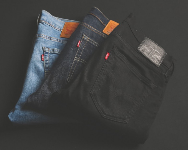 three assorted-color denim bottoms photo
