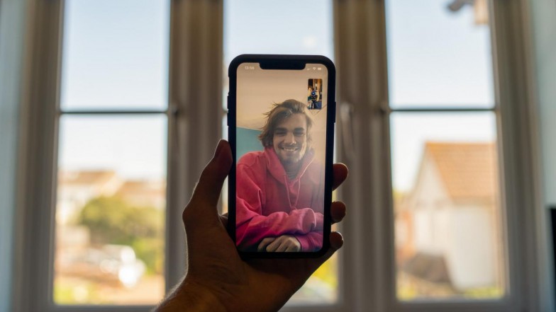 person holding black iphone 5 photo